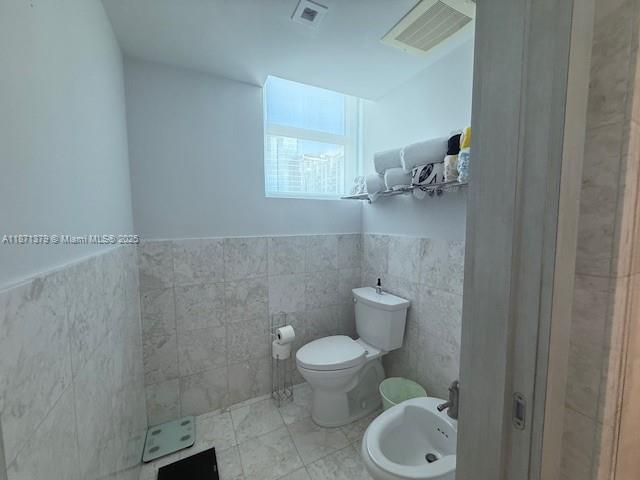 1331 Brickell Bay Drive, Unit 1602 Miami, FL 33131 - Photo 14 of 44 a bathroom with a toilet and a sink