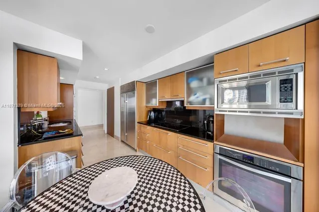 a bedroom with two beds and a flat screen tv