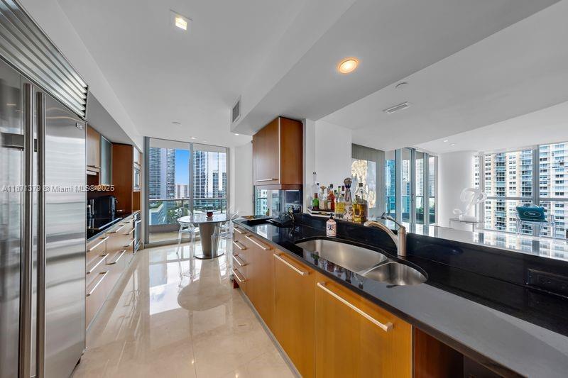 1331 Brickell Bay Drive, Unit 1602 Miami, FL 33131 - Photo 29 of 44 a large kitchen with lots of counter top space