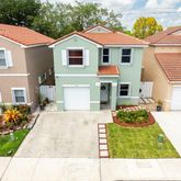 a house view with a garden space