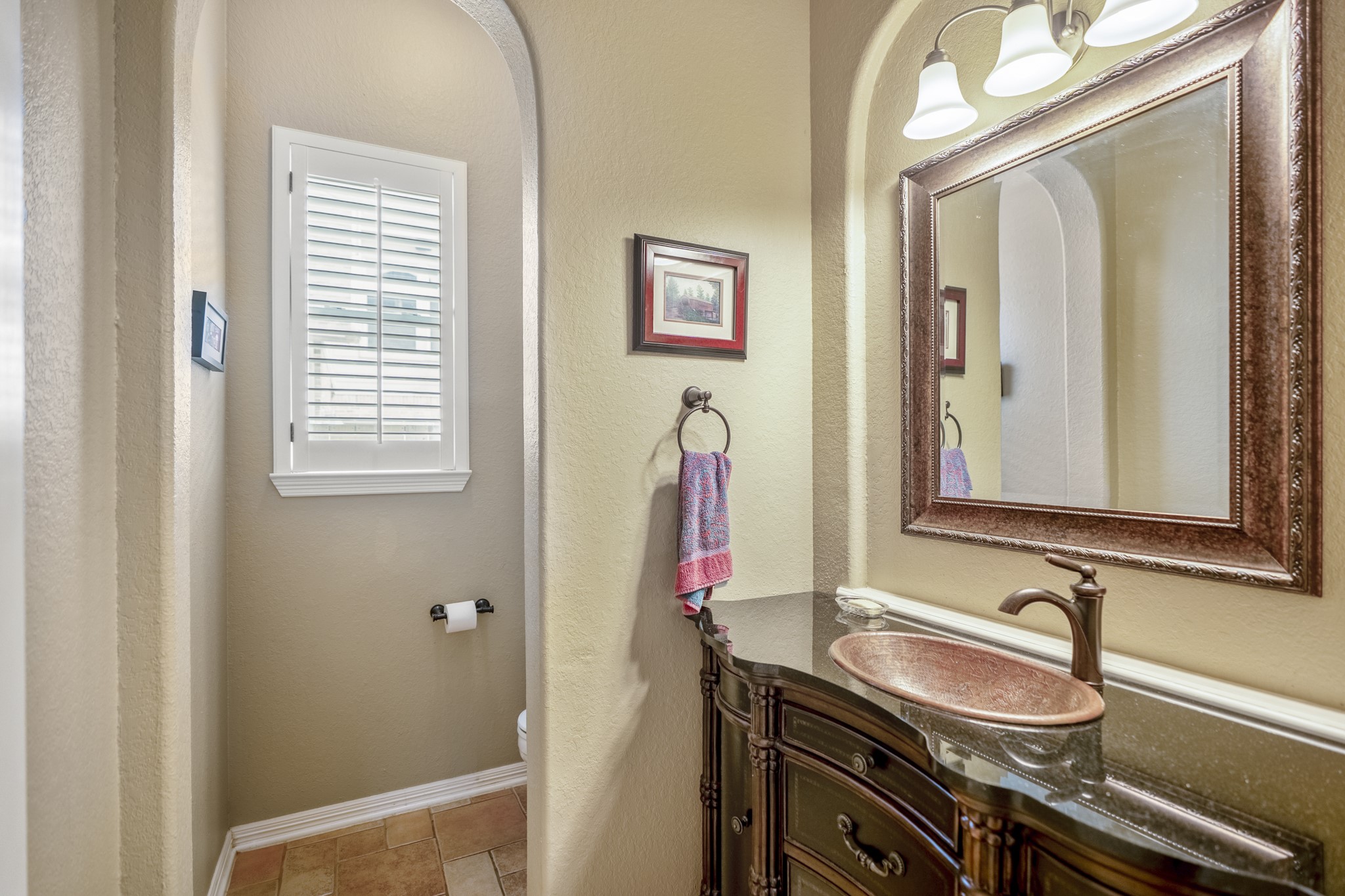 1438 Hatchmere Place Spring, TX 77379 - Photo 16 of 50 The perfectly positioned guest bathroom is downstairs with wooden cabinetry, gorgeous, framed mirror.