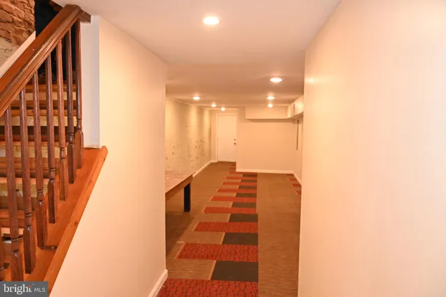 a bathroom with a black and white checkered floor