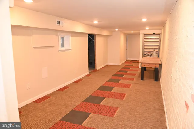 a front view of a house with barbeque seating space