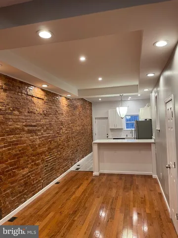 a view of a bathroom with a sink and a mirror