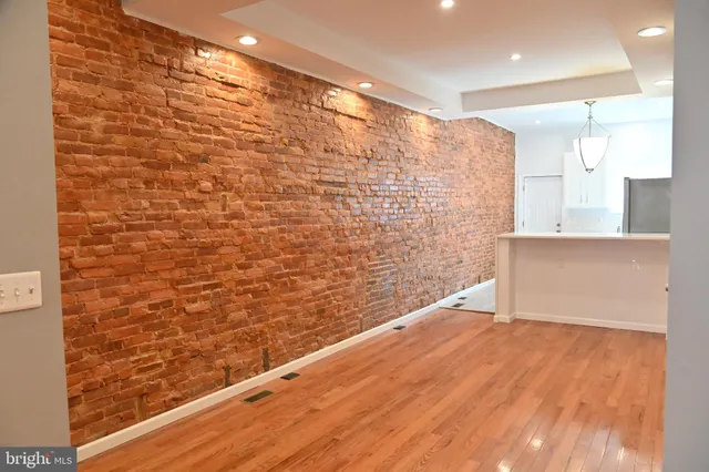 a view of kitchen with wooden floor