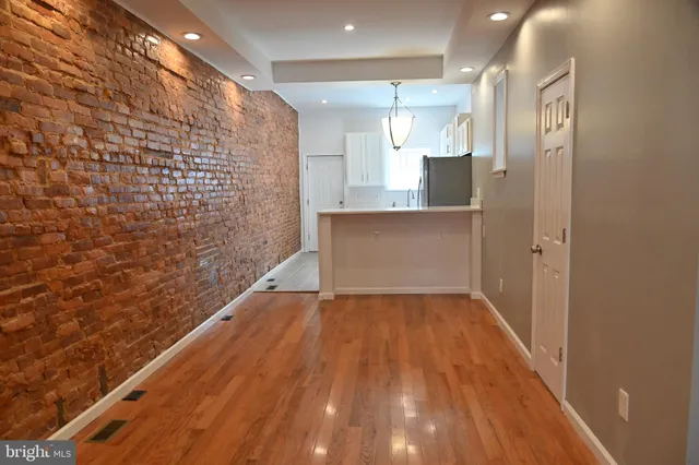 a kitchen with a refrigerator stove and microwave