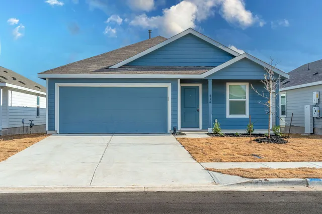 a front view of a house with yard