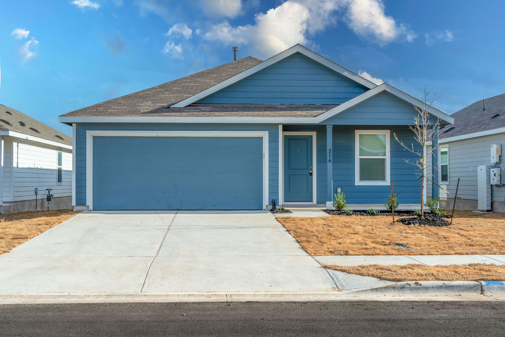 216 Little Sparklers Loop Hutto, TX 78634 - Photo 1 of 39 a front view of a house with yard