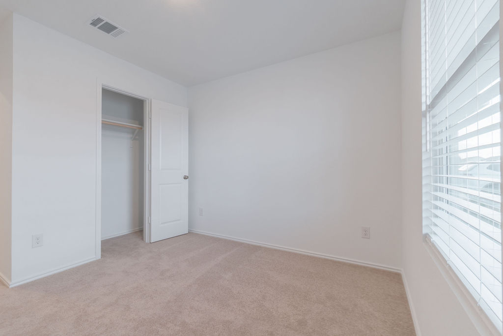 216 Little Sparklers Loop Hutto, TX 78634 - Photo 15 of 39 a view of an empty room and a window