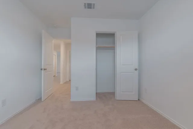 a view of a kitchen with refrigerator and microwave