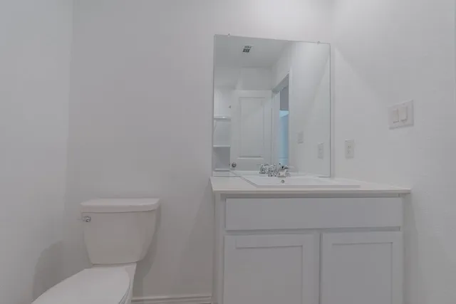 a view of an empty room and closet area