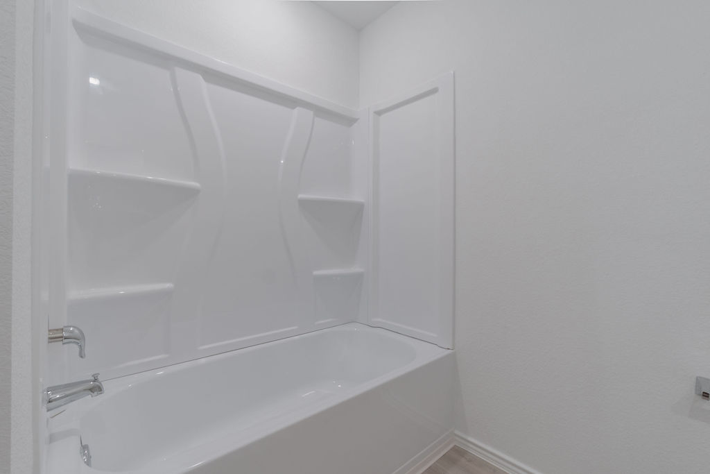 216 Little Sparklers Loop Hutto, TX 78634 - Photo 19 of 39 a close view of a bathtub in bathroom