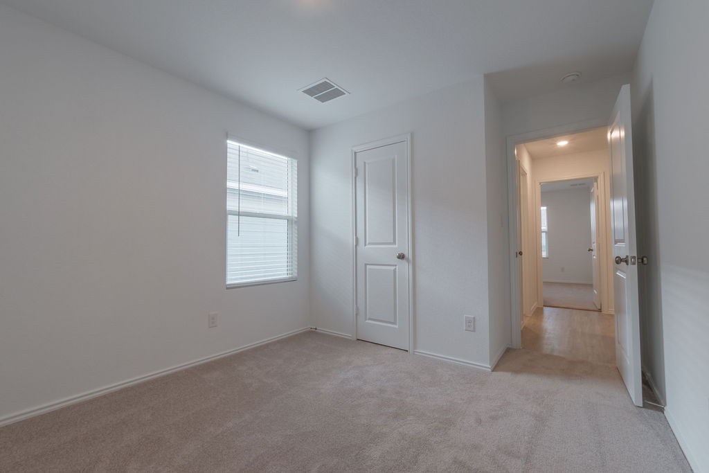 216 Little Sparklers Loop Hutto, TX 78634 - Photo 21 of 39 an empty room with windows and closet