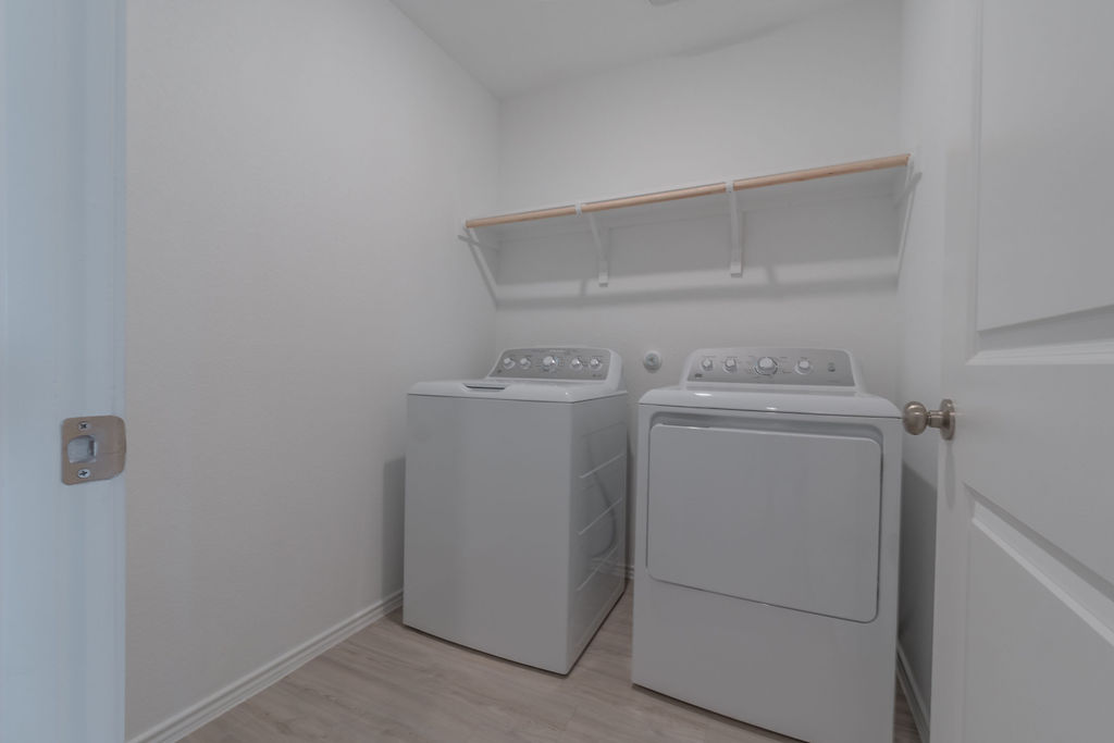 216 Little Sparklers Loop Hutto, TX 78634 - Photo 27 of 39 a utility room with dryer and washer