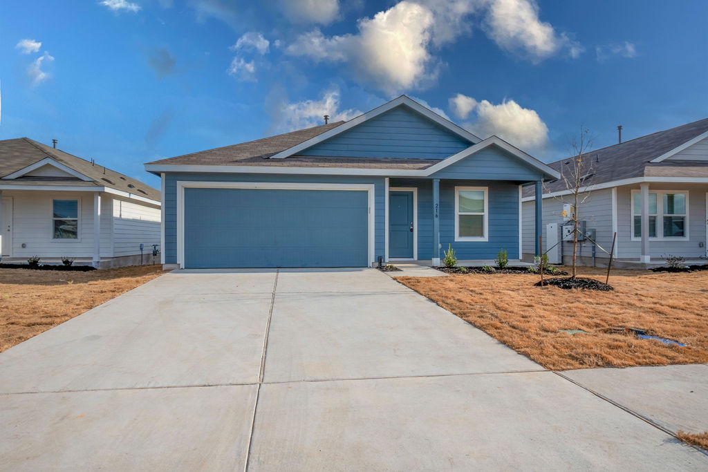216 Little Sparklers Loop Hutto, TX 78634 - Photo 3 of 39 a house view with a outdoor space