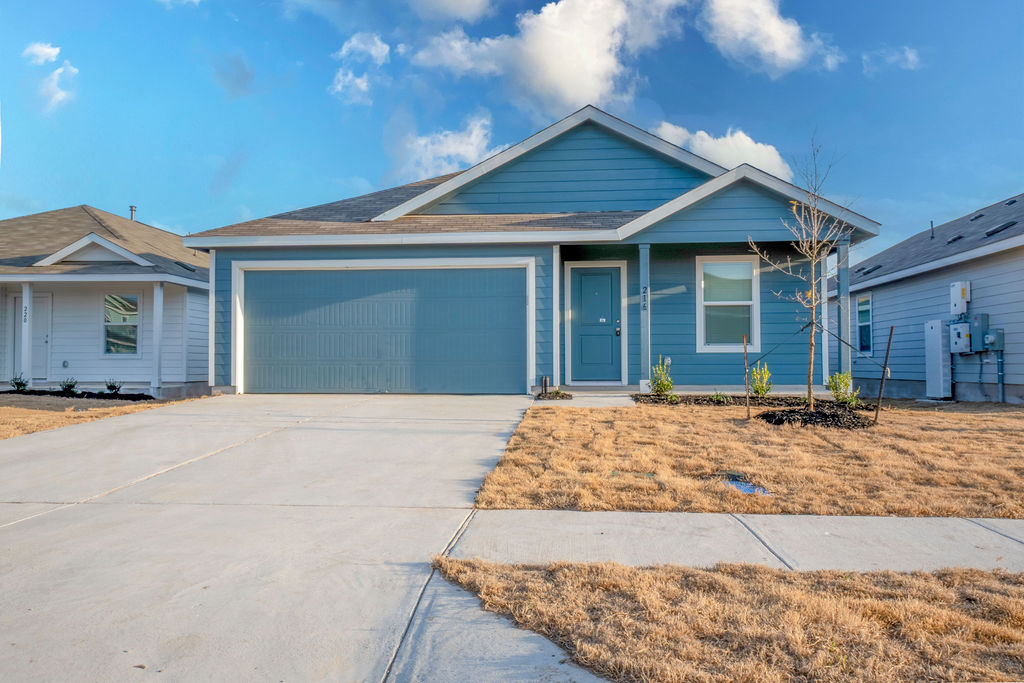216 Little Sparklers Loop Hutto, TX 78634 - Photo 36 of 39 a front view of a house with a yard