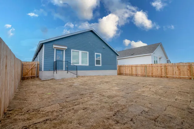a big room with closet and a large window