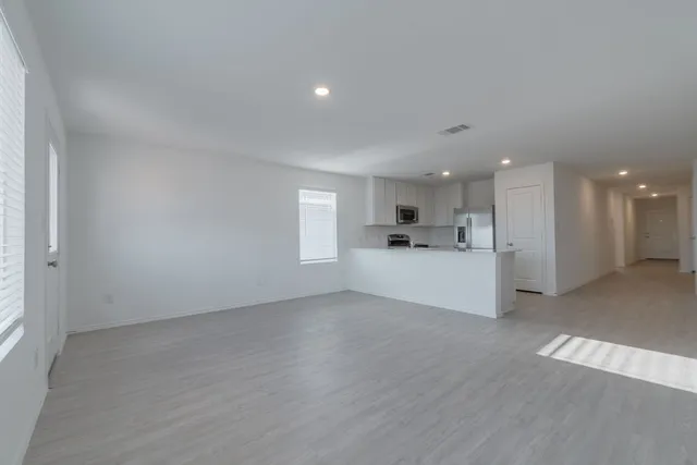 a view of a kitchen with a sink and a microwave