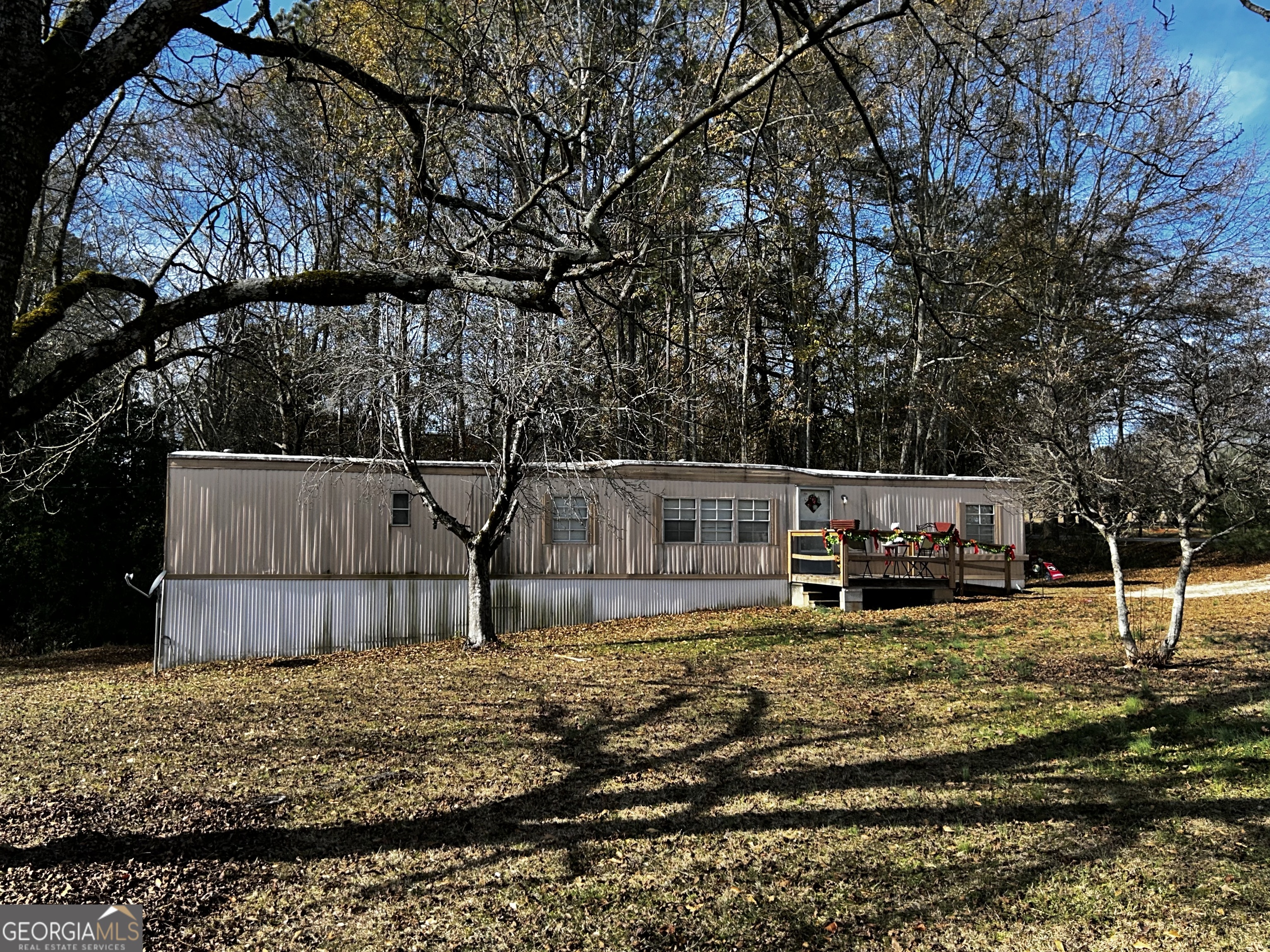 68 White Pine Road Toccoa, GA 30577 - Photo 9 of 11 a view of a backyard with wooden fence and a bench