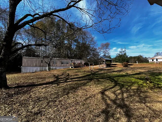 a view of backyard with green space