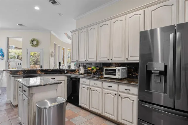 a kitchen with a sink stove and refrigerator