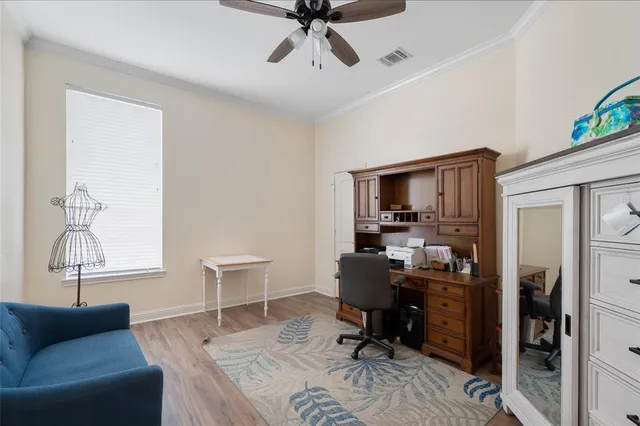 a work room with furniture and windows