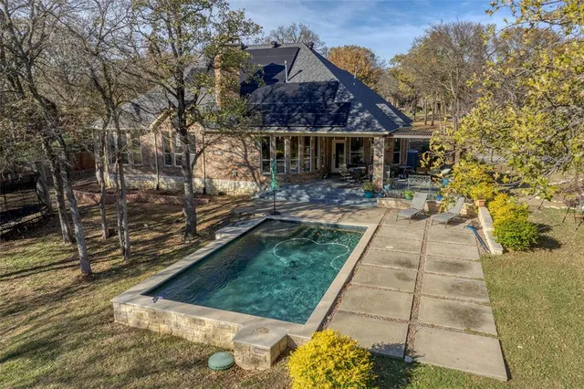 a view of house with yard