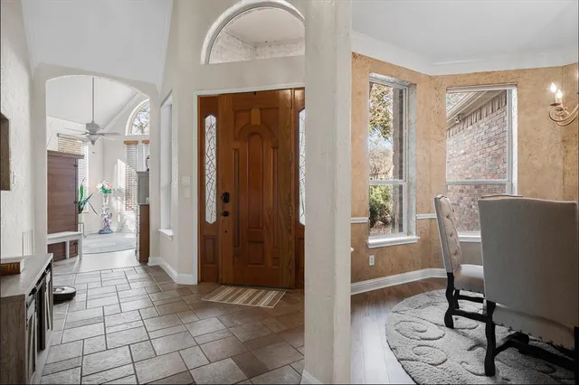a view of a livingroom with furniture and windows