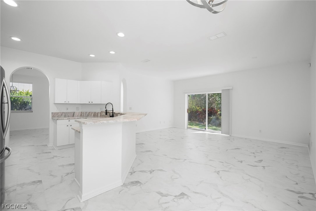 21768 Brixham Run Loop Estero, FL 33928 - Photo 11 of 36 a view of kitchen with granite countertop cabinets and sink