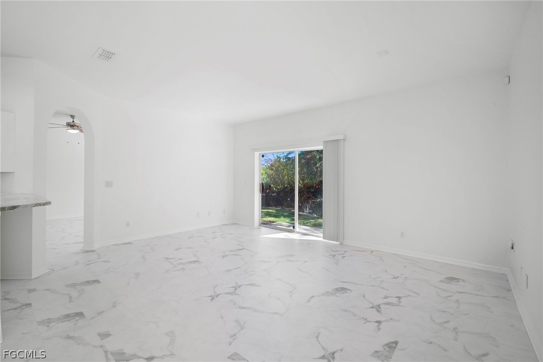 21768 Brixham Run Loop Estero, FL 33928 - Photo 12 of 36 an empty room with windows