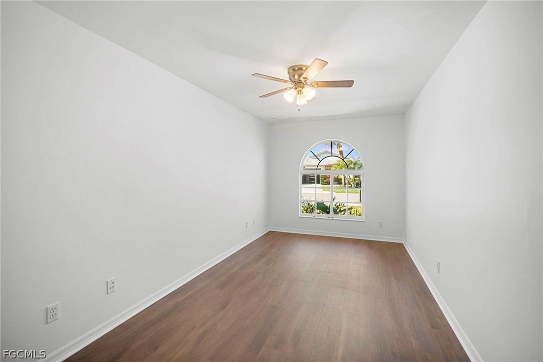 21768 Brixham Run Loop Estero, FL 33928 - Photo 18 of 36 an empty room with windows and ceiling fan