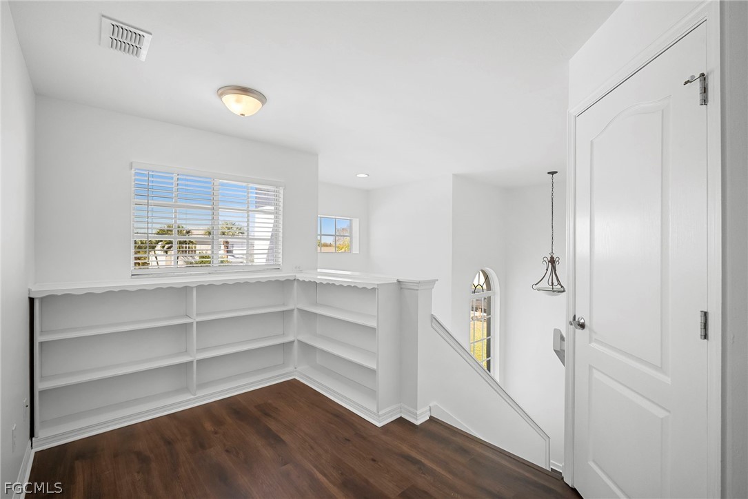 21768 Brixham Run Loop Estero, FL 33928 - Photo 21 of 36 a view of walk in closet with empty racks