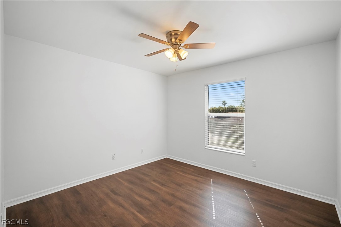 21768 Brixham Run Loop Estero, FL 33928 - Photo 22 of 36 a view of a livingroom with a ceiling fan and wooden floor