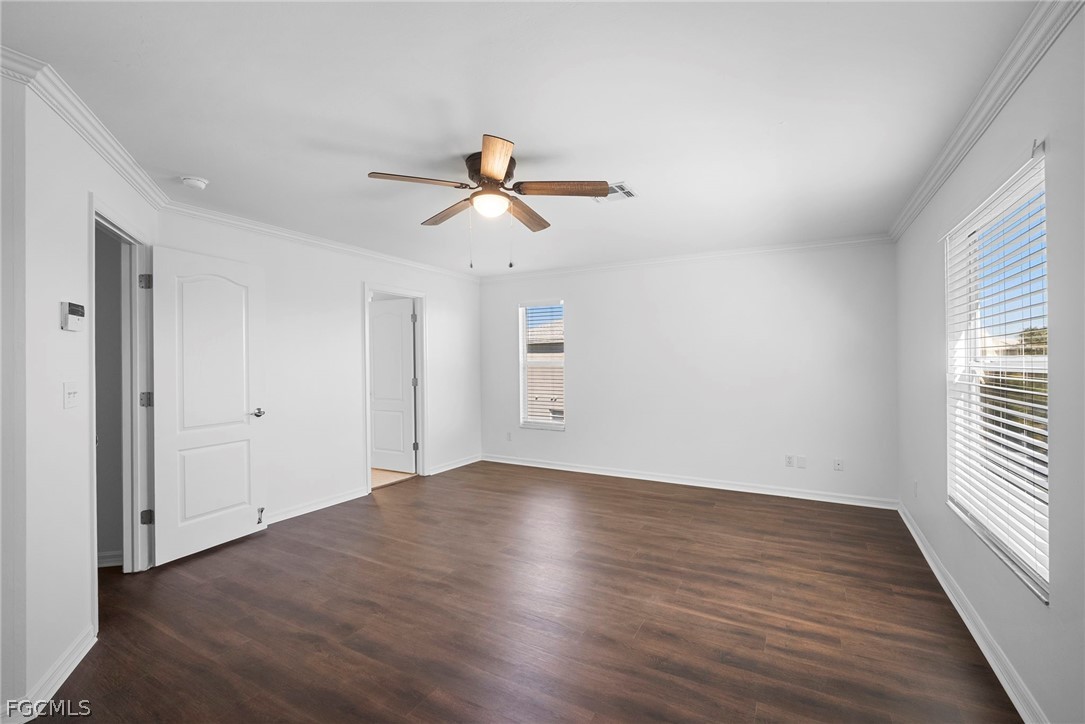 21768 Brixham Run Loop Estero, FL 33928 - Photo 24 of 36 wooden floor in an empty room with a window