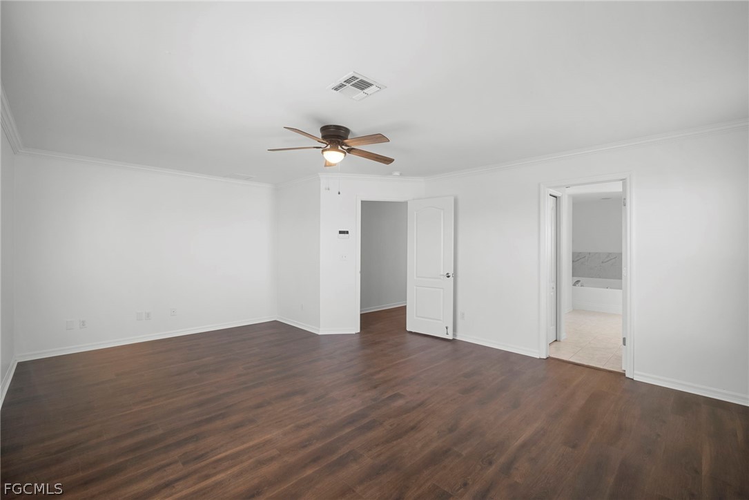 21768 Brixham Run Loop Estero, FL 33928 - Photo 25 of 36 a view of an empty room with wooden floor
