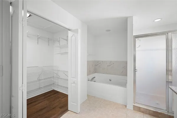 a bathroom with a bathtub and shower