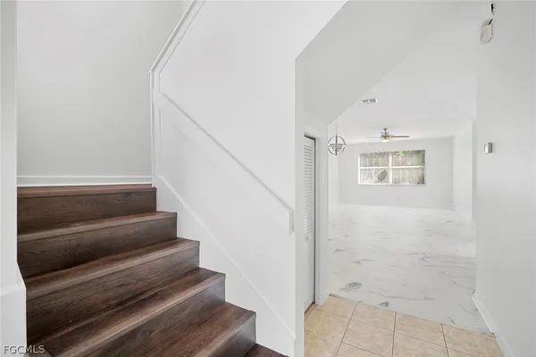 a view of staircase with white walls
