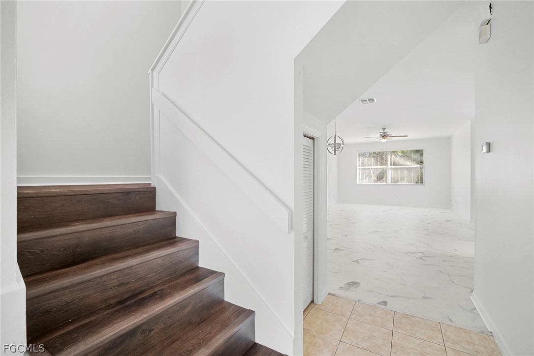 21768 Brixham Run Loop Estero, FL 33928 - Photo 3 of 36 a view of staircase with white walls