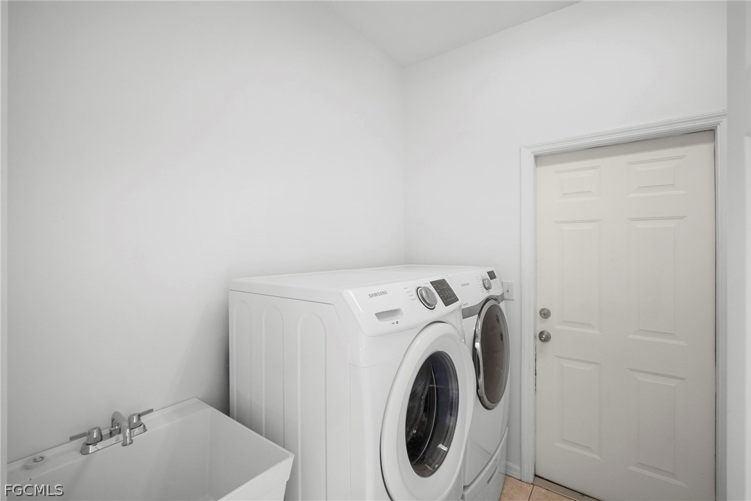 21768 Brixham Run Loop Estero, FL 33928 - Photo 32 of 36 a utility room with dryer and washer