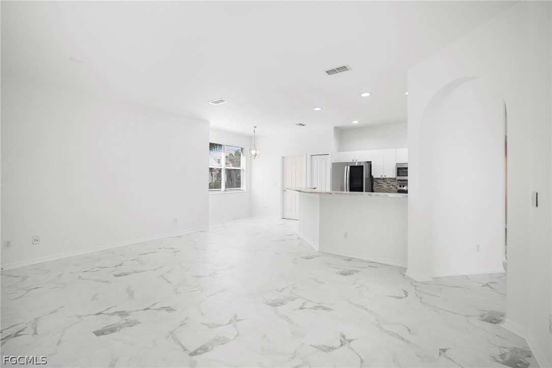 21768 Brixham Run Loop Estero, FL 33928 - Photo 9 of 36 a view of a kitchen with a sink