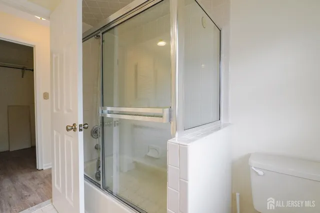 a bathroom with a shower and a sink