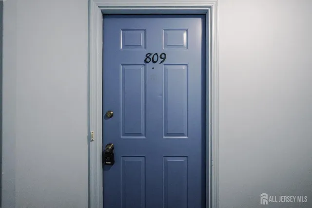 a view of a hallway with a door