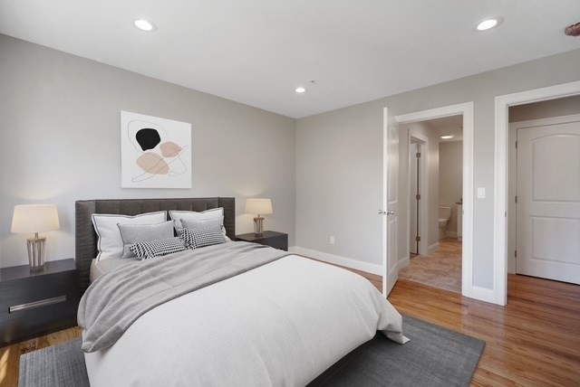 4 Sabrina Way, Unit E Feeding Hills, MA 01030 - Photo 10 of 16 a bedroom with a bed and wooden floor