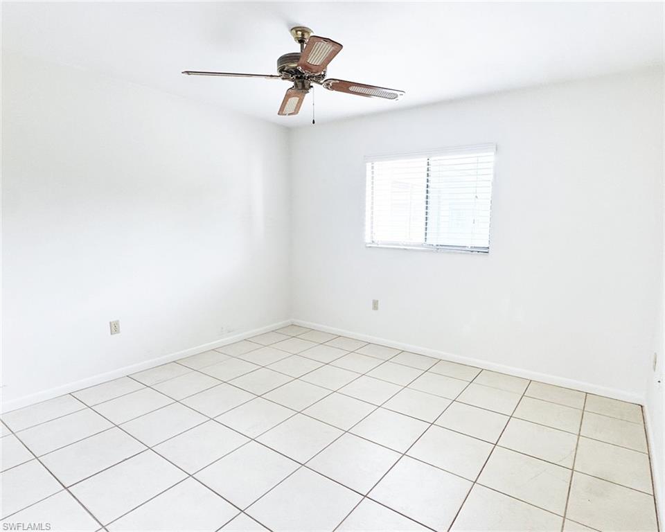 699 110th Avenue North, Unit B Naples, FL 34108 - Photo 12 of 23 a view of a room with window and ceiling fan
