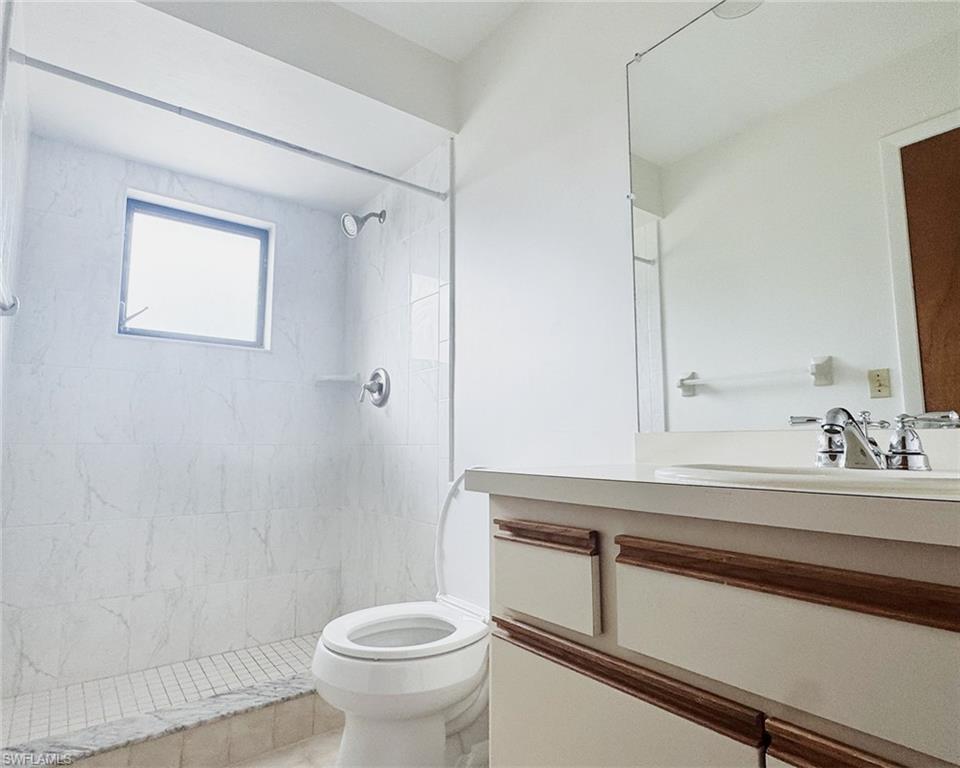 699 110th Avenue North, Unit B Naples, FL 34108 - Photo 14 of 23 a bathroom with a sink and a toilet