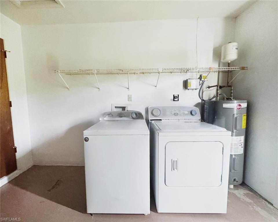 699 110th Avenue North, Unit B Naples, FL 34108 - Photo 18 of 23 a utility room with dryer and washer