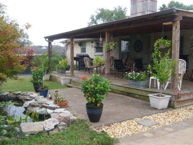 1241 Shawnee Road Madison, TN 37115 - Photo 13 of 15 Park Light backyard with koi pond...waterfall...covered deck!!