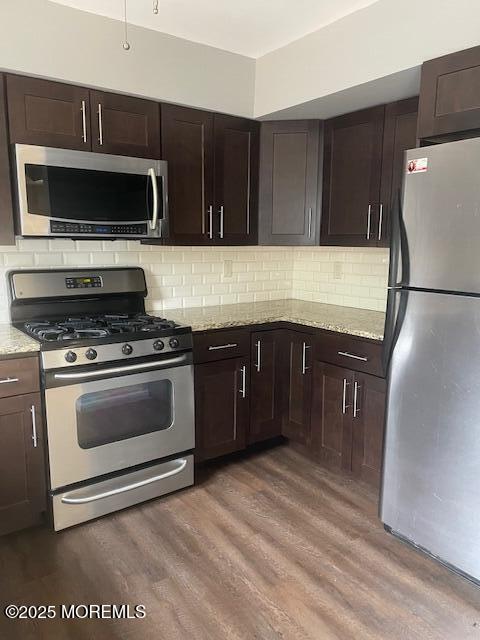 22 Forge Court Jackson, NJ 08527 - Photo 5 of 15 a kitchen with stainless steel appliances a stove a microwave and a sink