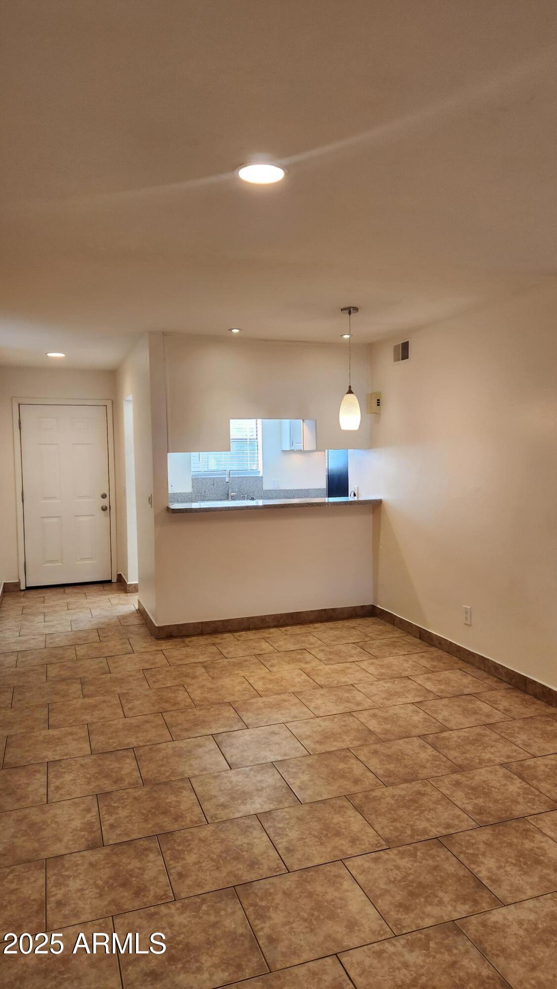 3119 North 38th Street, Unit 10 Phoenix, AZ 85018 - Photo 17 of 20 a view of a kitchen with a sink and cabinets