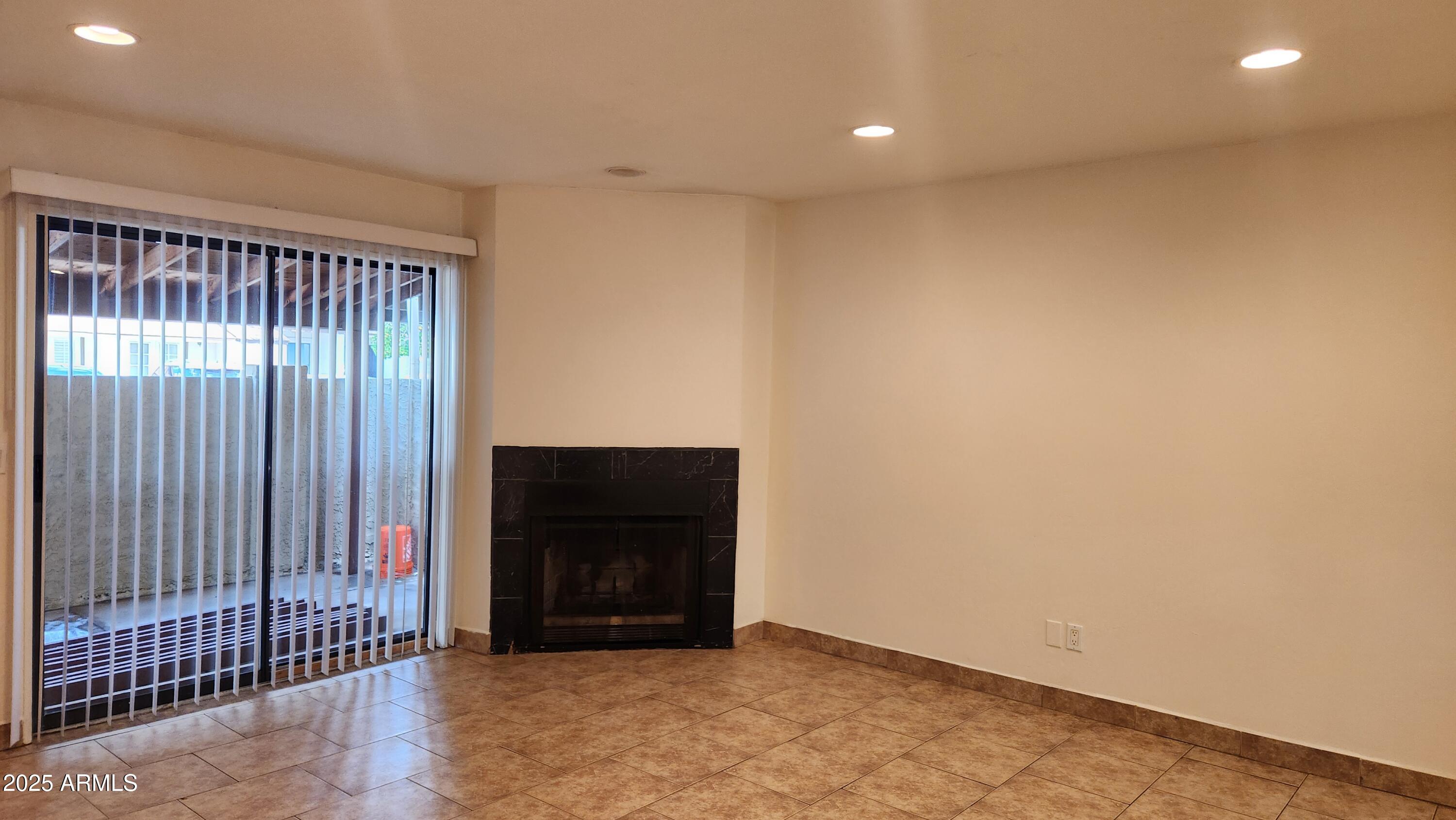 3119 North 38th Street, Unit 10 Phoenix, AZ 85018 - Photo 2 of 20 a view of an empty room and wooden floor